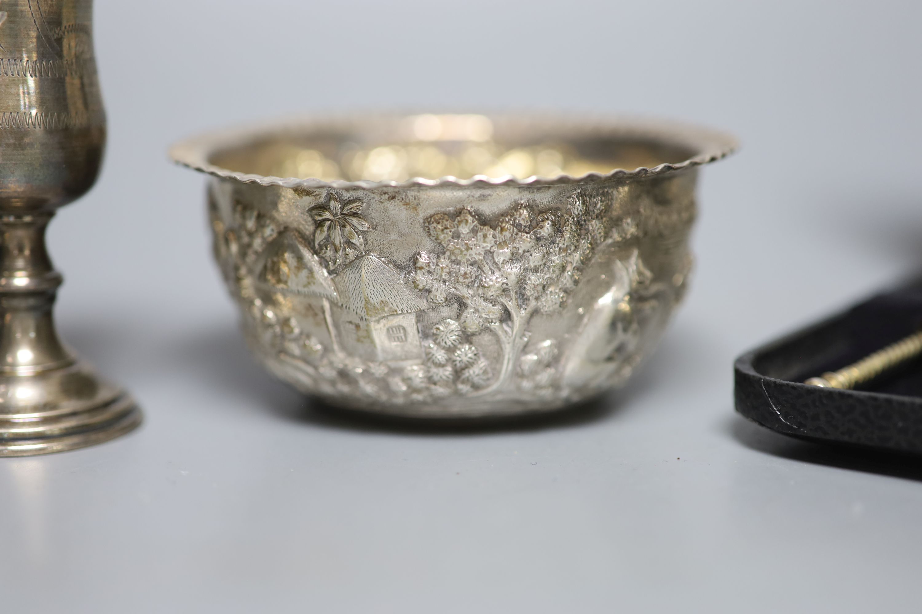 A cased set of six late 19th century Russian 84 zolotnik and niello teaspoons, three sterling kiddush cups, a French white metal napkin ring, a small sterling napkin ring and an Indian white metal bowl.